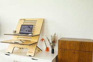 a desk with a computer on top of it by Standsome Worklifestyle courtesy of Unsplash.