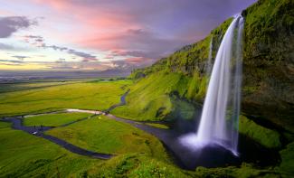 waterfalls at daytime by Robert Lukeman courtesy of Unsplash.