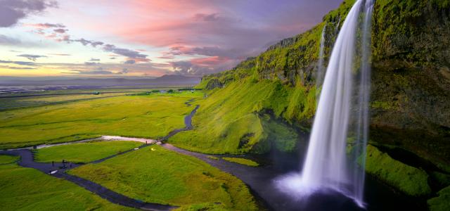 waterfalls at daytime by Robert Lukeman courtesy of Unsplash.